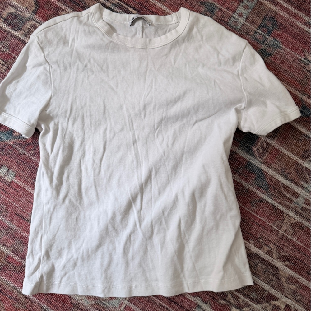 Plain white shirt size L but fits like M. Never worn